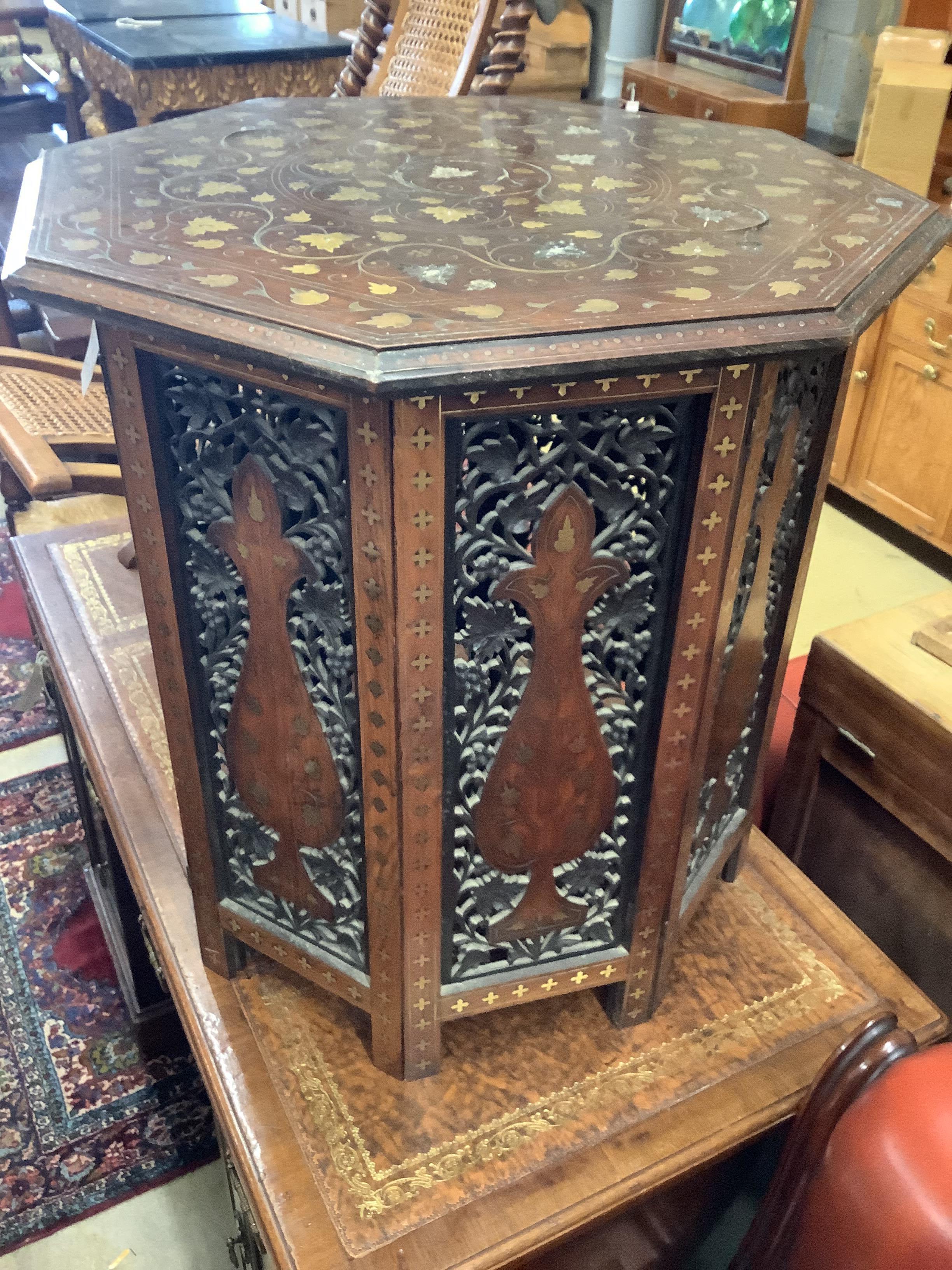 An Anglo-Indian Moorish design octagonal brass-inlaid coffee table, width 61cm, height 64cm on folding stand together with a Victorian cane folding seat chair